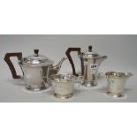 A silver four piece tea set, comprising; a teapot, a hot water jug,