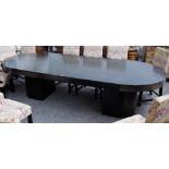 A large Art Deco style ebonised ash dining table with rounded rectangular top on a pair of