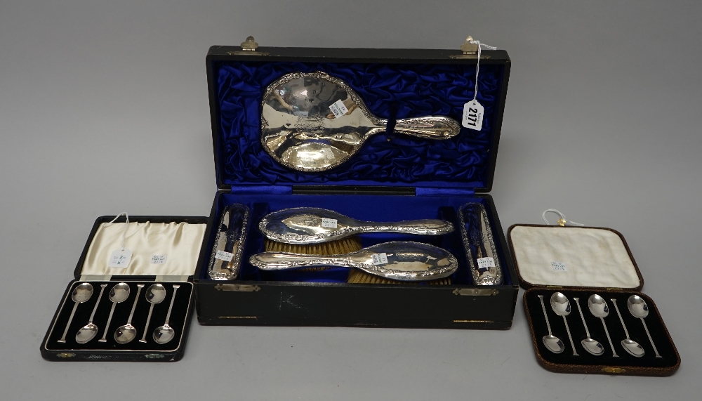 Silver and silver mounted wares, comprising; a lady's five piece dressing set, comprising; a mirror,