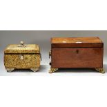 A George III mahogany rectangular tea caddy on gilt metal paw feet,