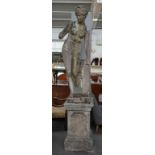 A reconstituted figure of a bathing lady on stepped square pedestal, 245cm high.