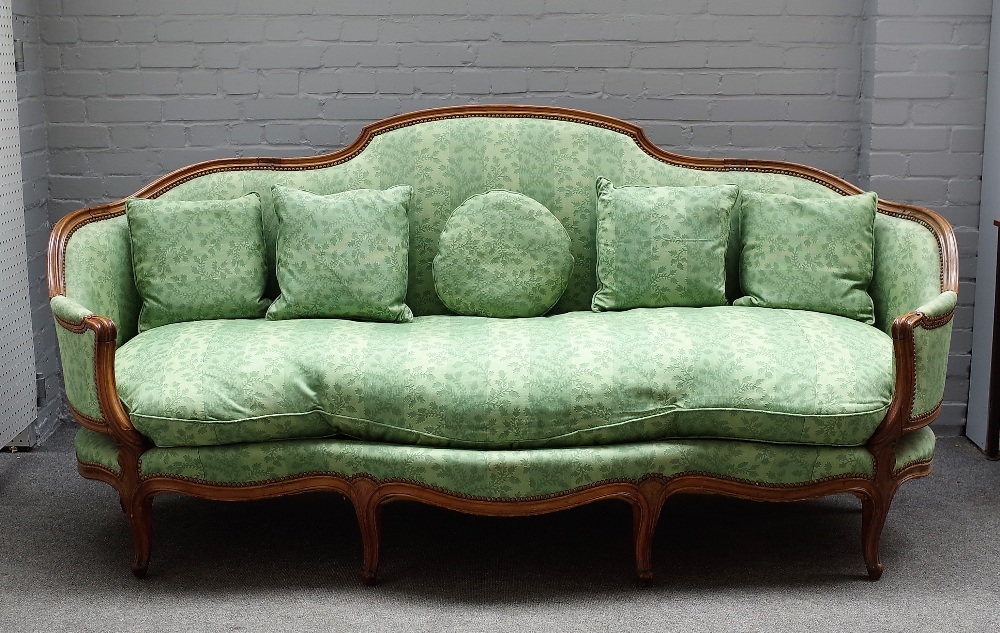 A Louise XV style beech framed canape/ sofa, with shaped back and seat on scroll supports,