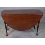 A mid-18th century mahogany oval drop flap table on pad feet, 115cm wide x 71cm high.