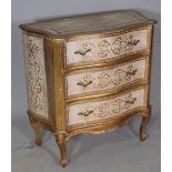 An Italian parcel gilt and gold painted serpentine chest of three drawers, 78cm wide x 80cm high.