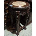 An early 20th century Chinese hardwood table, with marble inset top, 33cm wide x 62cm high.