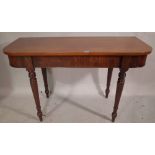 A Victorian mahogany console table on ring turned tapering supports, 120cm wide x 73cm high.