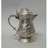 An Italian hinge lidded wine jug, of baluster form, with a foliate capped thumbpiece,