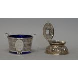 A George VI silver twin handled butter dish, of circular form, with pierced and reeded decoration,
