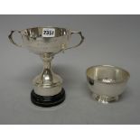 A silver bowl of plain circular form, on a stepped pedestal foot, by Asprey & Co,