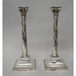 A pair of Victorian table candlesticks, each with a tapered stem,