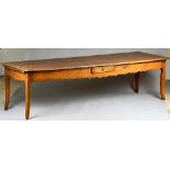A 19th century French fruitwood kitchen table,