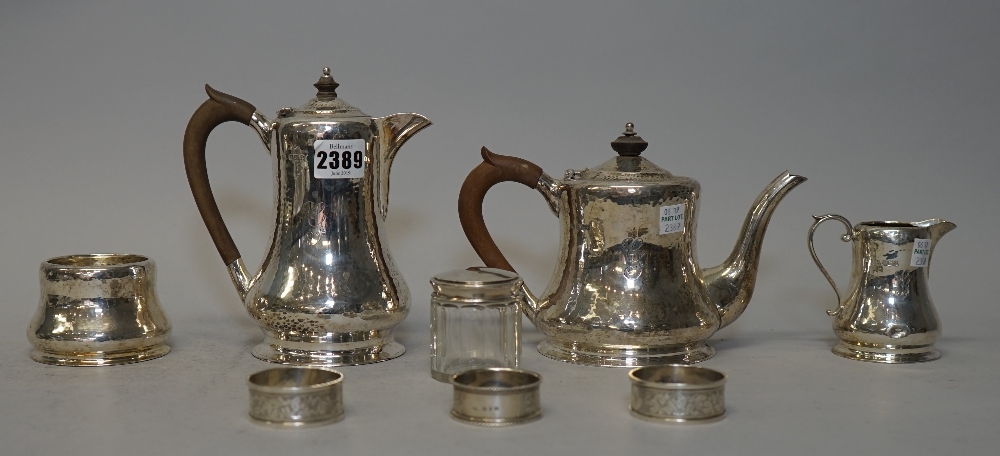A George V silver four piece tea set, comprising; a teapot, a hot water jug,