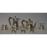 A George V silver four piece tea set, comprising; a teapot, a hot water jug,