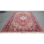 A Bakhtiari carpet, white ground with polychrome medallion and floral decoration,
