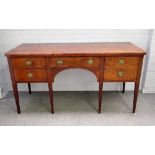 An early 19th century mahogany sideboard with five frieze drawers on tapering square supports,