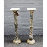 A pair of late Victorian variegated grey marble pedestals, chamfered tops on ring turned columns,