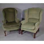 A 20th century hardwood framed wingback armchair,