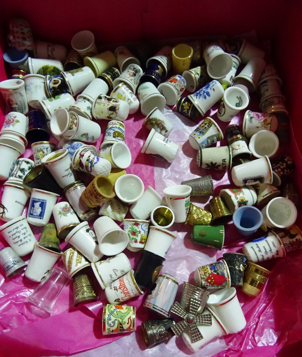 A box of mainly 20th century porcelain thimbles,