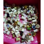 A box of mainly 20th century porcelain thimbles,
