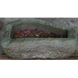A carved stone irregular oval shaped trough, 110cm wide x 40cm deep x 33cm high,
