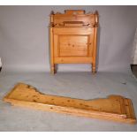 An early 20th century pine single sleigh bed, 90cm wide x 125cm high.