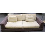 Natuzzi; a 20th century square back sofa in brown suede upholstery, 223cm wide x 65cm high.