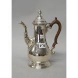 A George III silver coffee pot of baluster form,