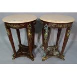 A pair of regency style stained beech and gilt metal mounted circular occasional tables,