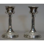 A pair of Art Nouveau silver candlesticks,