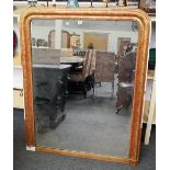 A 19th century gilt framed arched top mirror with floral chased frame, 111cm wide x 140cm high.