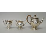 A George V silver three piece tea set, comprising; a teapot,
