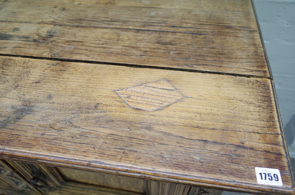 A 17th century style carved oak dresser base, with three recessed panel doors, on turned supports, - Image 4 of 5