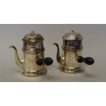 A pair of Continental silver chocolate-pots and covers,