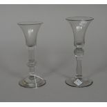 Two wine glasses, mid 18th century, the first with bell bowl with teared knop and domed foot, (a.