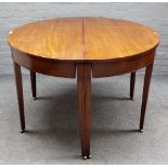 A George III mahogany D-end extending dining table on tapering square supports, three extra leaves,