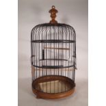 A 20th century French dome top bird cage 85cm high and another bird cage, 43cm wide x 51cm high,