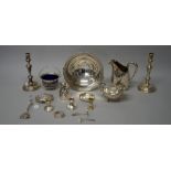 Silver, comprising; a pair of silver table candlesticks (loaded), London 1946,