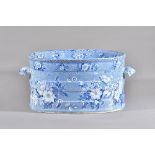 A Staffordshire blue and white printed two-handled oval footbath, 19th century,