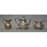 A Victorian silver three piece tea set, comprising; teapot, sugar bowl and milk jug,