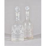 A pair of early 20th century engraved glass decanters and matched stoppers