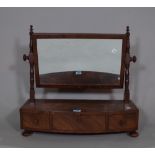 A George III mahogany toilet mirror with three drawers, on bun feet, 53cm wide x 46cm high.