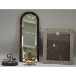 A tortoiseshell mounted wall mirror with bevelled plate, 55cm high; a Dunhill photograph frame, 37.