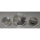 A George V silver octagonal tray, having a reeded border and raised on four downswept feet,