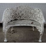 A pair of white painted Coalbrookdale style cast aluminum shaped benches,