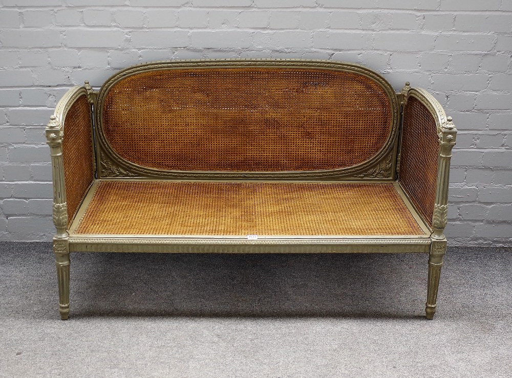 A 19th century and later green painted French small sofa,