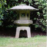 A Japanese carved stone hexagonal garden lantern, 20th century, 126cms high.