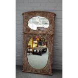 An Eastern limed wood twin plate tall mirror, carved gadrooned decoration, 72cms wide, 138cms high.