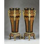 A large pair of gilt metal mounted Boulle work pedestals,