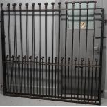 A pair of 20th century iron gates with sphere decoration, 388cm wide x 183cm high.