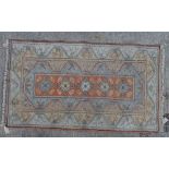 A Turkish rug, 206cm x 118cm.